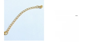 Detail of gold extension chain with O-chain links and small bead drop for jewelry