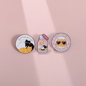 Cute enamel cat pins featuring Certified Cat Lady and Anti Depressants text on pink background