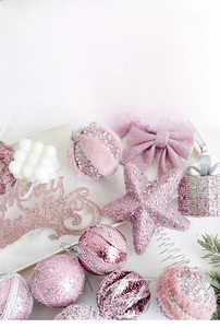 Pink Christmas ball set with glitter stars, ornaments, and Merry Christmas sign