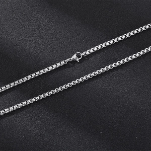 Minimalist silver stainless steel box chain necklace with lobster clasp on black background