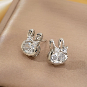 Silver geometric rabbit stud earrings with sparkling cubic zirconia bow accents