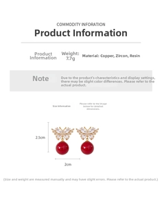 Macro detail of red ball drop earrings with gold butterfly zircon stud and 7.7g weight