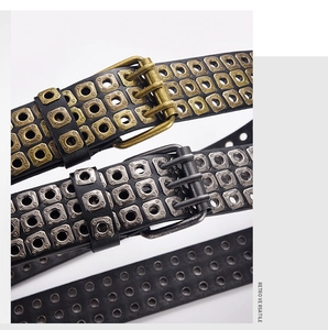 Detailed view of punk style PU leather belts with bronze and silver square metal eyelets