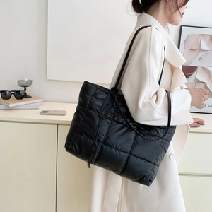 Chic black quilted puffer tote bag for women with glossy nylon finish and slim straps