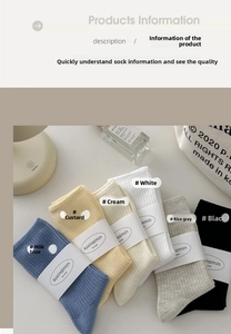 Close-up of ribbed cotton crew socks in neutral tones with minimalist brand packaging