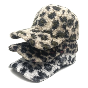 Stack of leopard print leopard print baseball caps in fuzzy faux shearling fabric for autumn