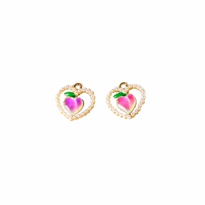 Golden heart frame earring charms with pink peach motifs and elegant pearls on white base