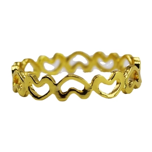 Hollow heart-shaped napkin ring in golden metal finish on a plain white background