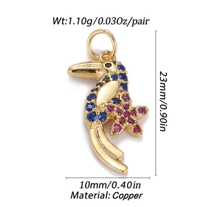 Detailed view of golden toucan pendant with blue and pink stones including size specifications