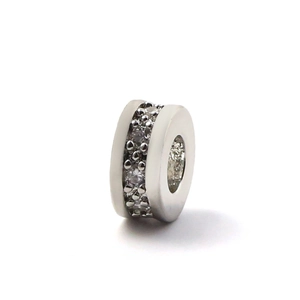 Macro detail of silver plated spacer bead with micro-pave cubic zirconia for DIY jewelry