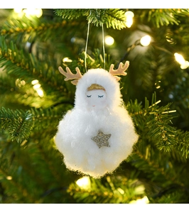 Close-up of white plush reindeer angel ornament with gold star on a Christmas tree