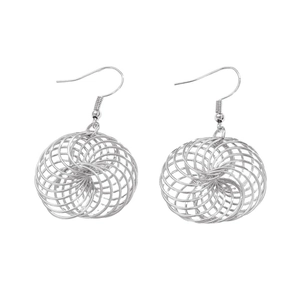 Detailed macro view of silver hollow wire-wrapped bird's nest design drop earrings