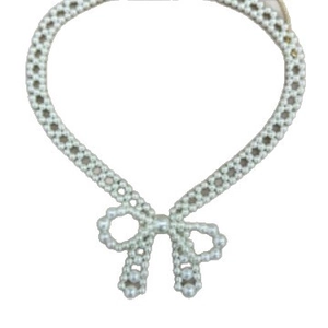 Elegant French style pearl necklace with a central bow design on a white background