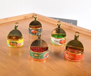 Miniature canned food toys including caviar and beef models on a wooden tray