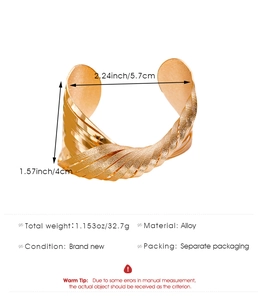 Detail view of gold alloy cuff bracelet featuring a twisted multilayer leaf branch design