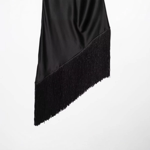 Elegant black satin dress with high-gloss finish and long fringe tassel detailing