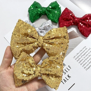 Sparkly sequin bows in gold, green, silver, and red for kids hair accessories and decor