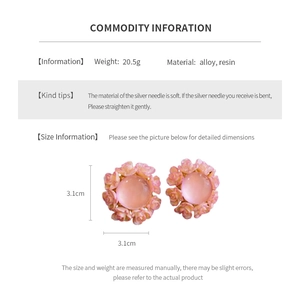 Detail view of pink resin flower earrings showing dimensions and alloy materials