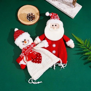 Knitted Christmas gift bags featuring 3D Santa and Snowman figures with drawstring closures