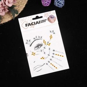 Close-up of face jewel stickers with silver and gold crystals for creative makeup art