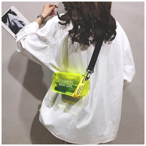 Detail of neon yellow transparent PVC crossbody bag with Fashion Mini Girl print