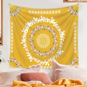 Detailed texture of mandala tapestry with rose wreath hanging in a cozy bedroom