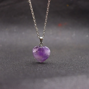Natural heart-shaped amethyst crystal pendant necklace on a polished silver chain