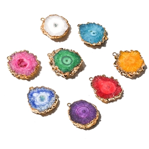 Natural agate slice sunflower pendants with gold-plated edges in various vibrant colors