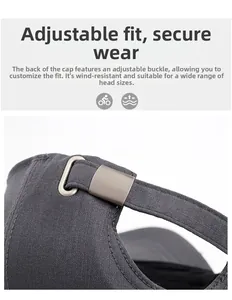 Detail of adjustable metal buckle and twill fabric texture on dark grey baseball cap