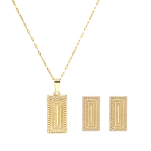 Detailed shot of golden rectangular jewelry set with leaf texture and geometric patterns