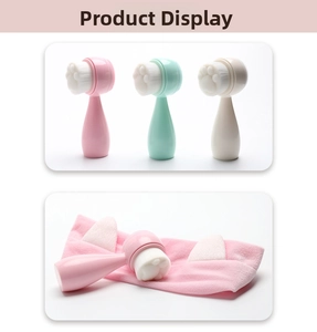 Close-up of cat paw silicone facial brush and matching cat ear headband in pink and mint colors