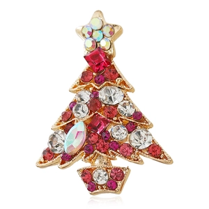 Golden Christmas tree brooch with multicolored rhinestones and star detail on white background