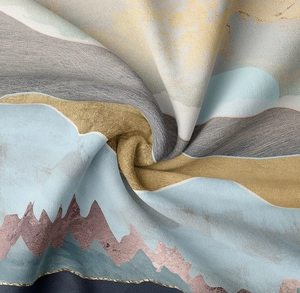 Detail of mountain print tapestry with gold foil accents and twill fabric texture