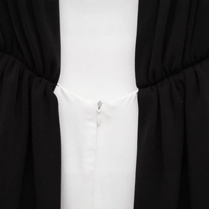 Women's black and white contrast mini dress with invisible zipper and pleated waist detail