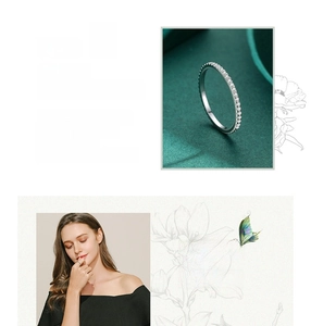 Detail of 925 sterling silver eternity ring with micro-pave crystals on velvet background