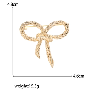 Fashion gold bow brooch with textured mesh pattern, 4.8cm size for suits and coats