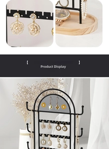 Detail of arc grid jewelry display stand with earrings, necklaces and wooden base