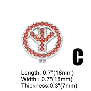 Macro detail of silver peace sign pendant with red cubic zirconia and dimensions