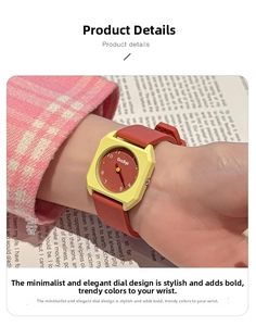 Macro view of square quartz watch with yellow matte case and red silicone strap
