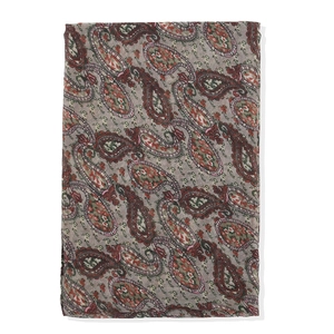 Close-up of retro bohemian paisley print fabric in grey with colorful patterns