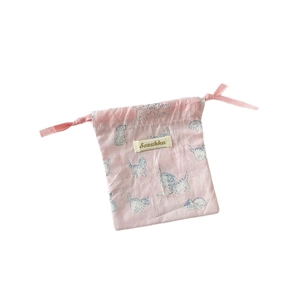 Pink drawstring storage bag with cute blue cat print and soft cotton fabric texture