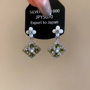 Vintage silver flower and diamond shape earrings with green crystals and pearls
