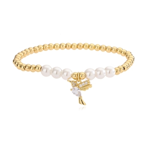 Elegant gold beaded bracelet with white pearls and a hummingbird charm inlaid with zircon