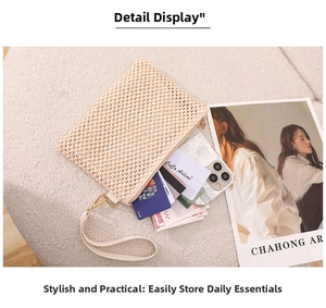 Macro detail of beige woven straw wristlet bag with gold zipper and mesh texture