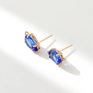 Detail of 14k gold plated oval blue zircon earrings with DIY hanging loops