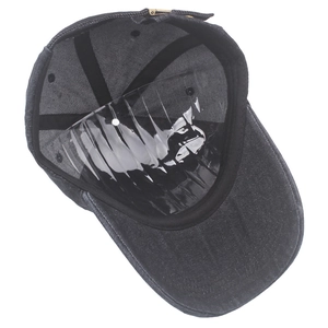 Detailed interior of dark denim baseball cap showing sweatband and adjustable metal buckle