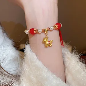 Bracelet tressé rouge avec perles en cristal et pendentif cheval doré pour femme