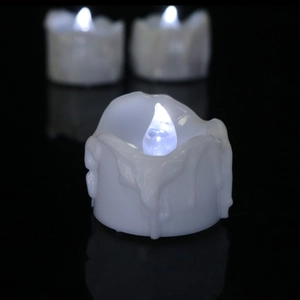 Close-up of LED electronic candles with dripping wax effect for festive party decoration