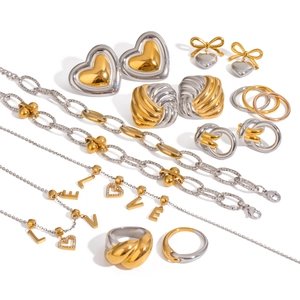 Two-tone stainless steel jewelry set featuring heart earrings, necklaces and rings
