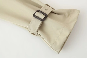 Khaki twill short coat featuring adjustable cuffs with dark brown buckles and stitching